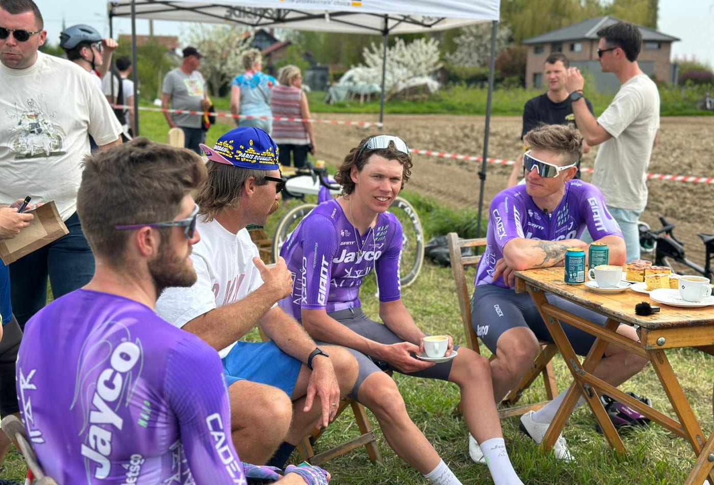 Mitch Docker talking with professional cyclists at a Classics race stop